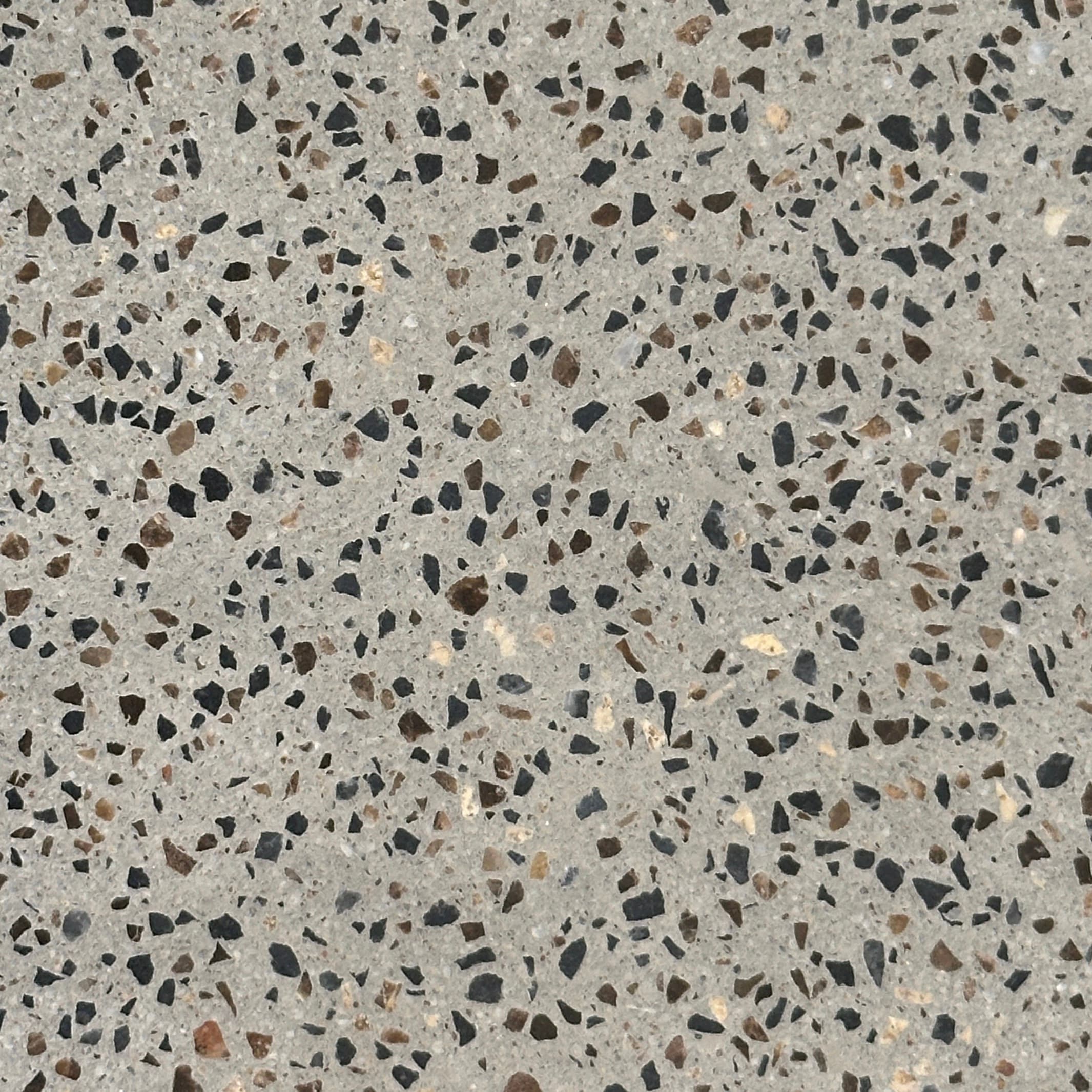 Terrazo gris con copos negros y blancos.